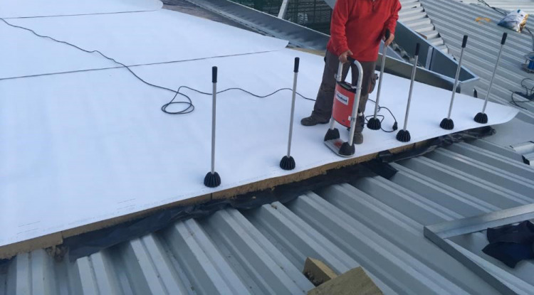 Why Choose a Commercial Roofer Who Uses the RhinoBond System?